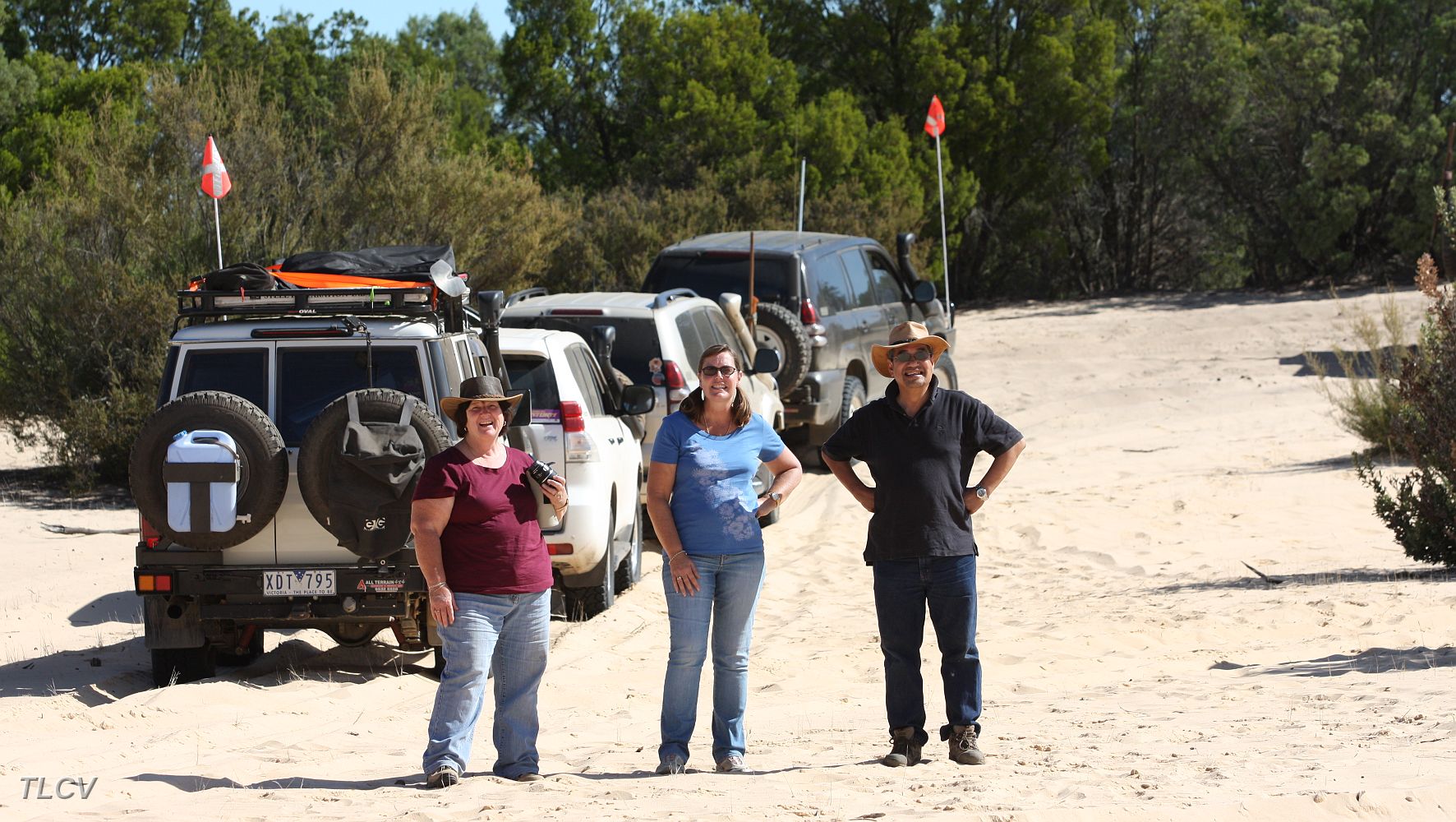 21-Carol, Karen & Vince watch one of our convoy climb Ross Springs dune.JPG